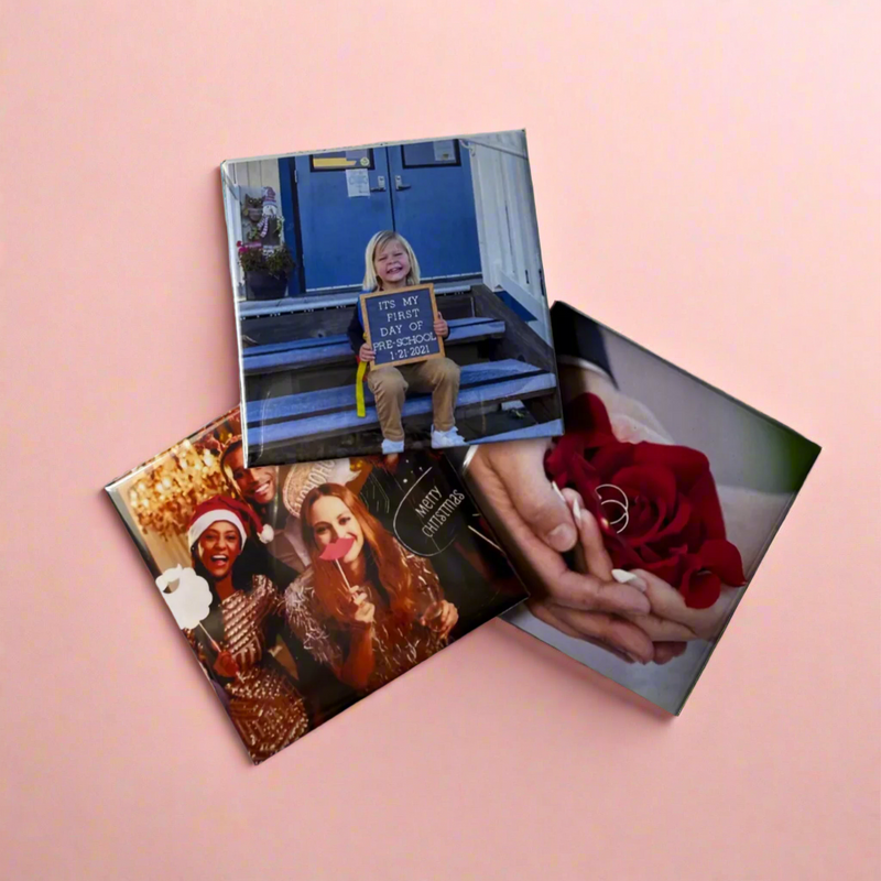 Three photo magnets on a pink background, featuring different images.